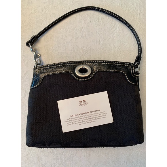 Coach Handbags - Coach Black Signature Collection Turnlock Wristlet